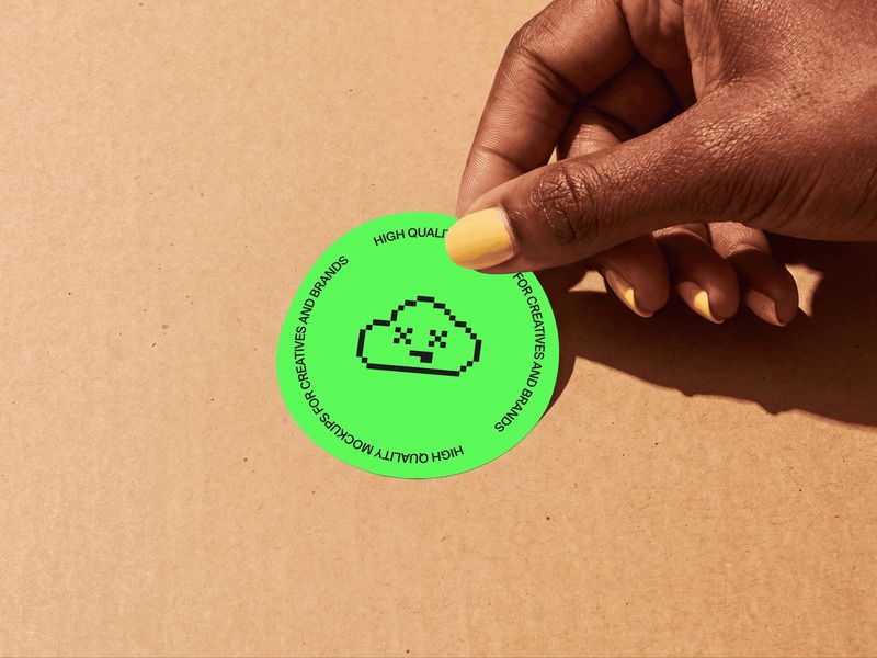 Round Sticker Mockup in Hand