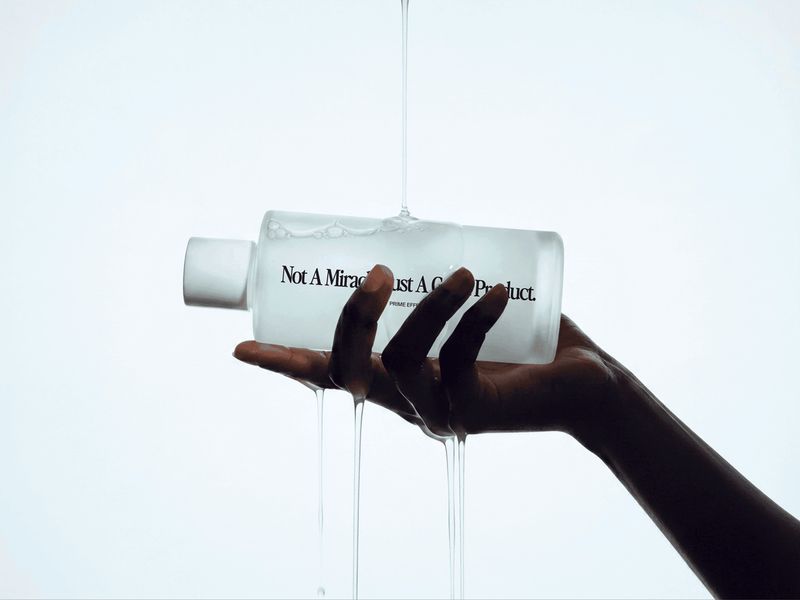 Skincare Lotion Bottle in Hand Mockup