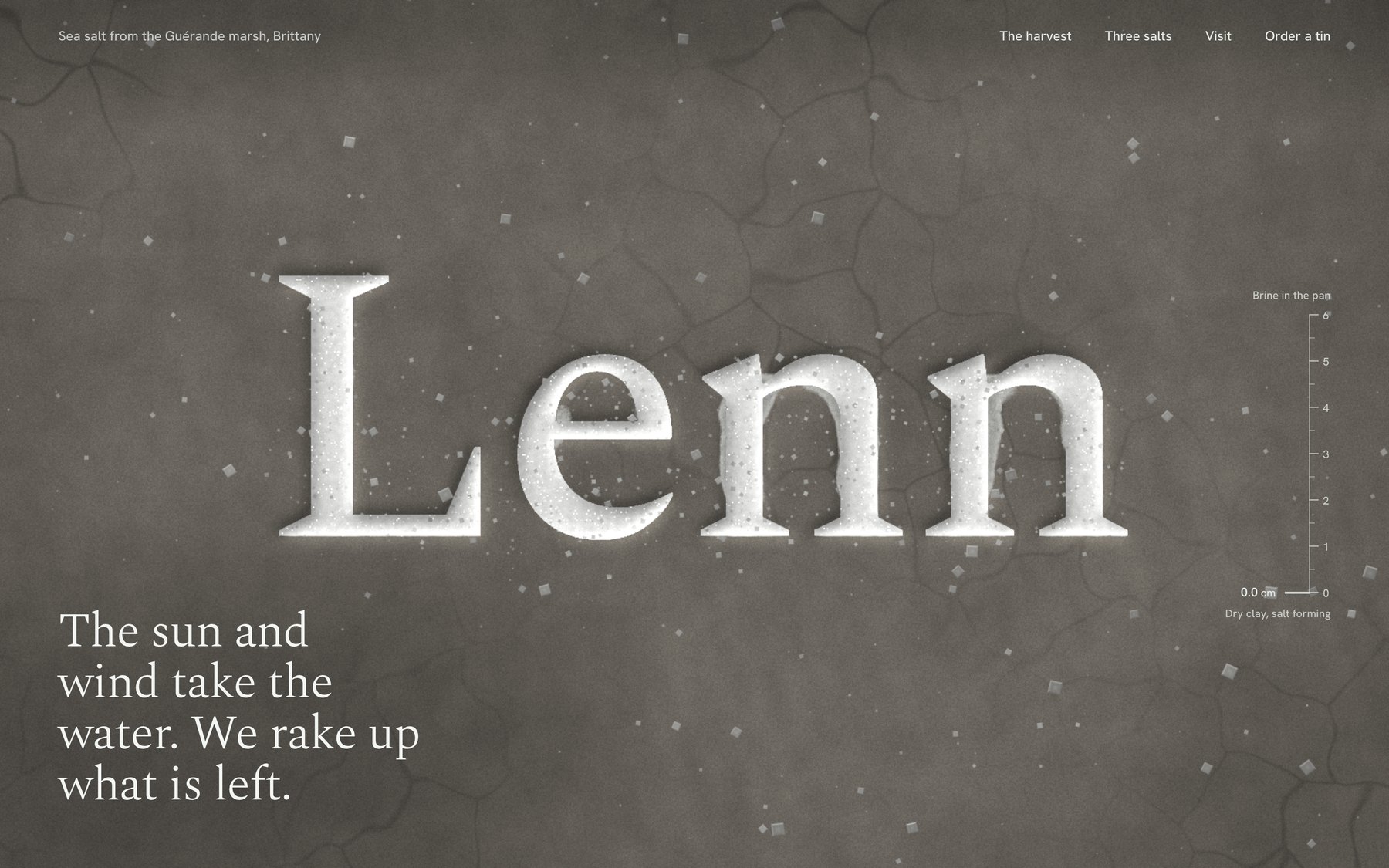The Lenn hero after the tide has drained: the wordmark dried white in cracked grey clay, scattered salt crystals, and the line The sun and wind take the water. We rake up what is left.