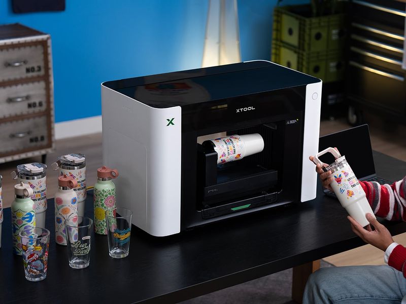 xTool O1 Omni UV Printer Prints on Wood, Metal, Glass, and Your T-Shirts, All From One Desktop Machine
