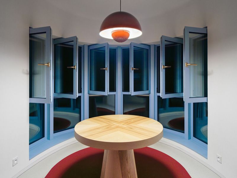 Blue Windows and Colorful Interiors Transform a Modernist Apartment Building in Prague